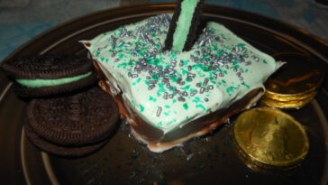 Delicious slice of Lucky Charms Oreo Dessert on a plate.